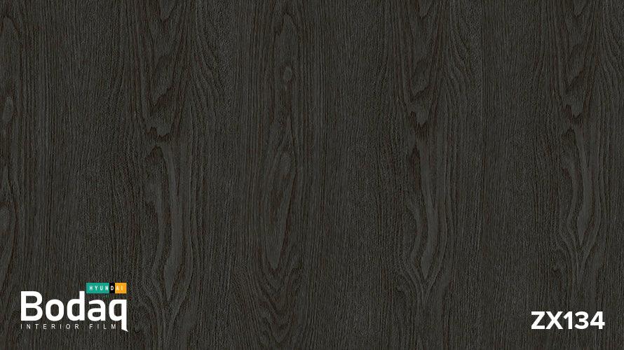 Dark wood grain texture sample labeled Bodaq Interior Film ZX134 by Hyundai